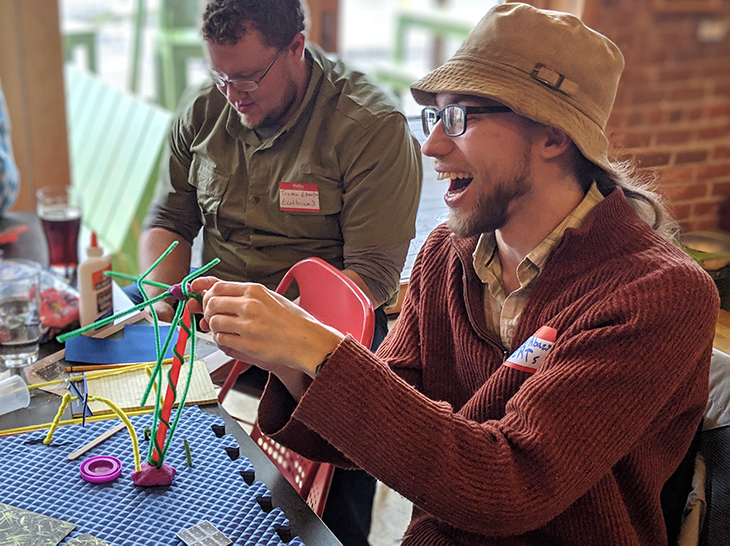 Participants at Solar Garden Design Event make models of solar panels.