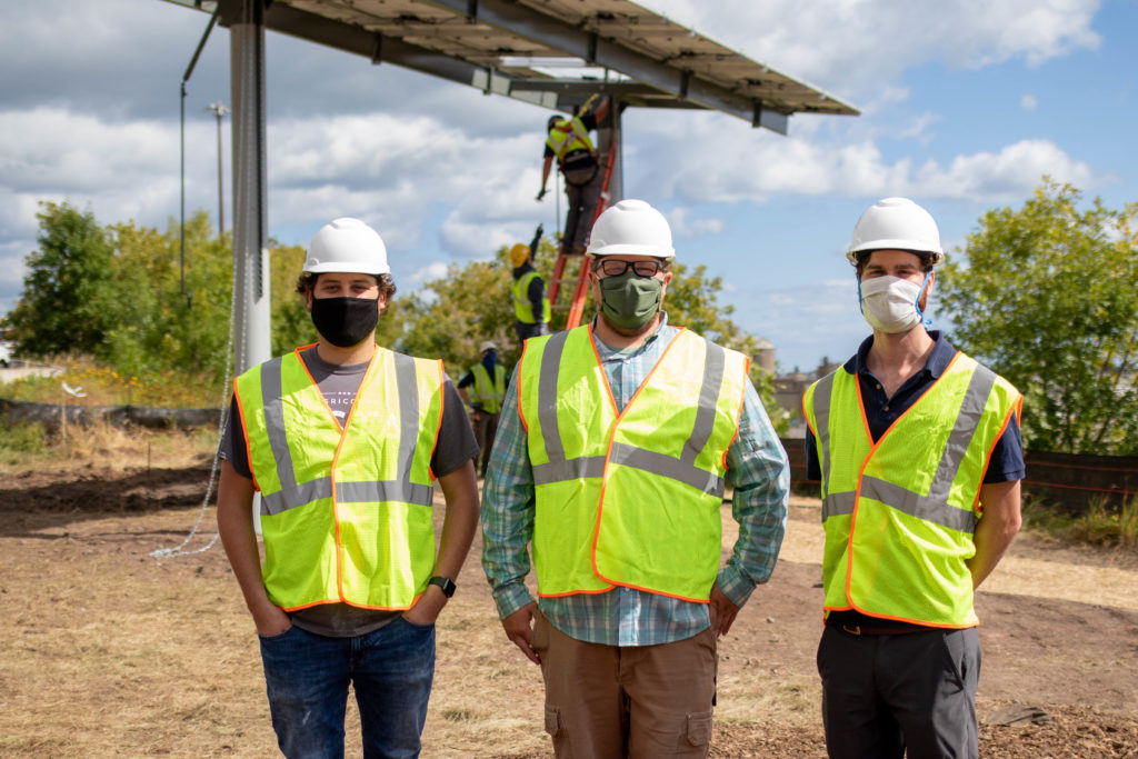 Volunteers in front of the first raised panel of the Lincoln Park Solar Garden