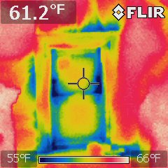 Infrared image of window. Detailed description in accompanying text. Blue coloring shows cold air is coming in at the wall around the window.