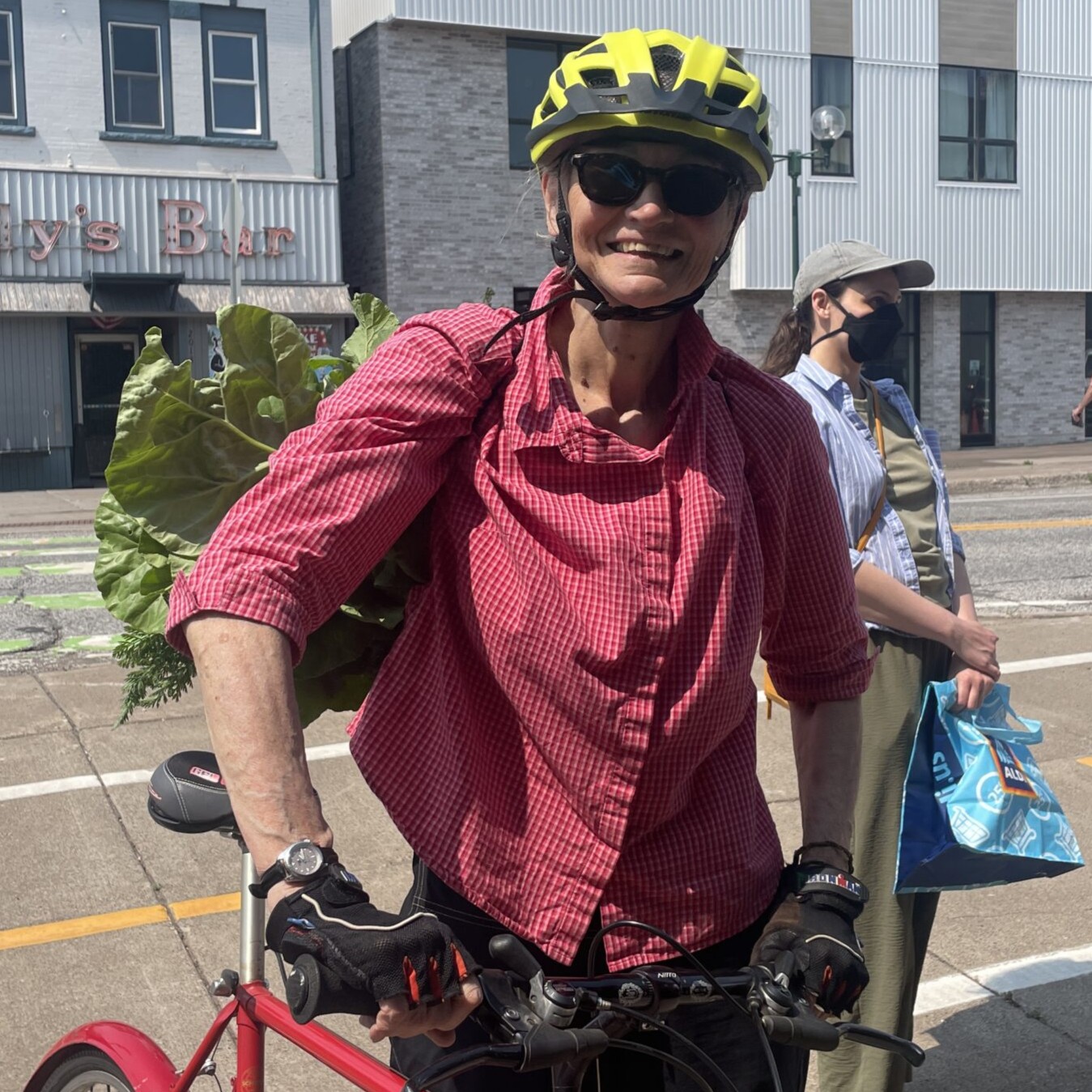 Woman with groceries and bike